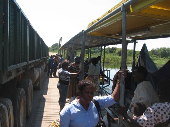 Foot passengeres seeking shade on ferry