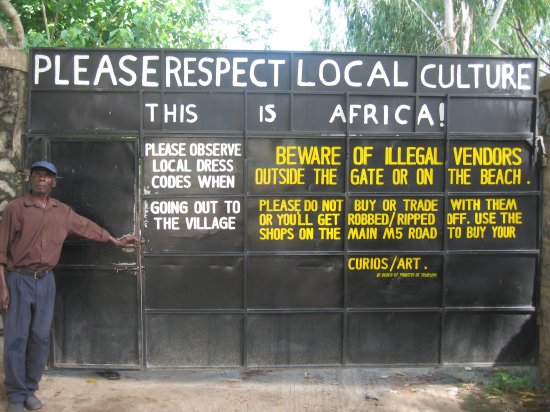 Gate as you leave Kande Beach: THIS IS AFRICA