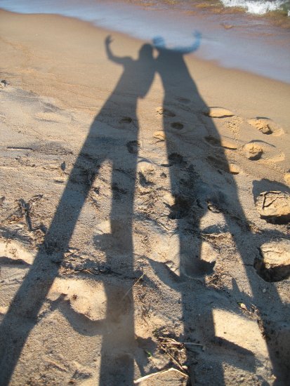 our shadows on Kande Beach