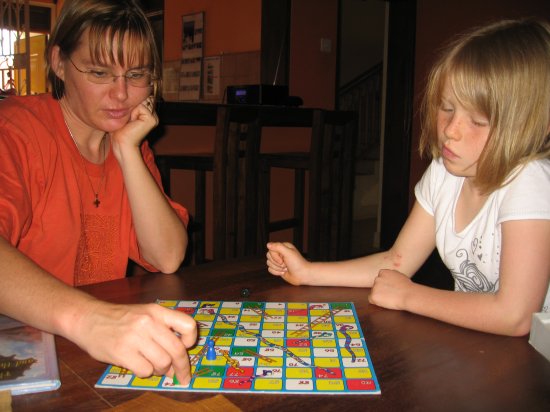 Claire and Ceria play snakes and ladders