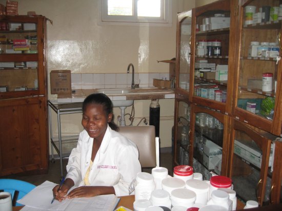 HCL pharmacist behind her counter