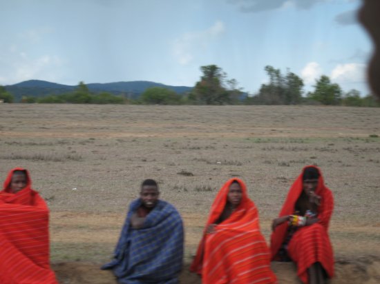 locals huddled together by the road