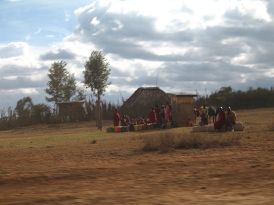 women gathering water at borehole
