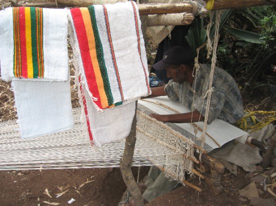 man weaving cloth