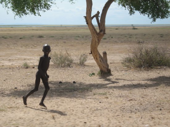 random boy running alongside