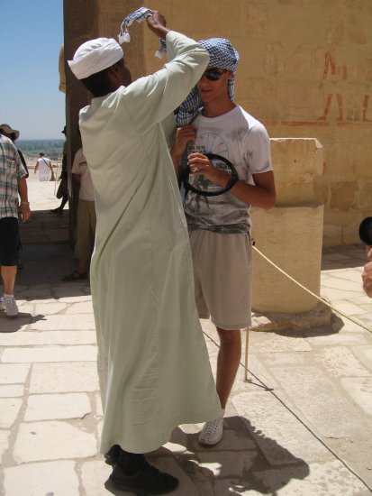 serbian tourist getting advice headgear