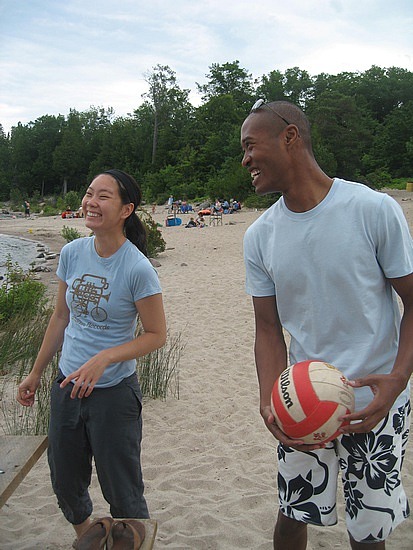 Anice and Rhema playing volleyball on beach