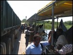 Foot passengeres seeking shade on ferry