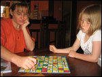 Claire and Ceria play snakes and ladders