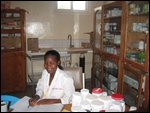 HCL pharmacist behind her counter