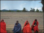 locals huddled together by the road