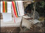 man weaving cloth