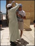 serbian tourist getting advice headgear