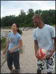 Anice and Rhema playing volleyball on beach